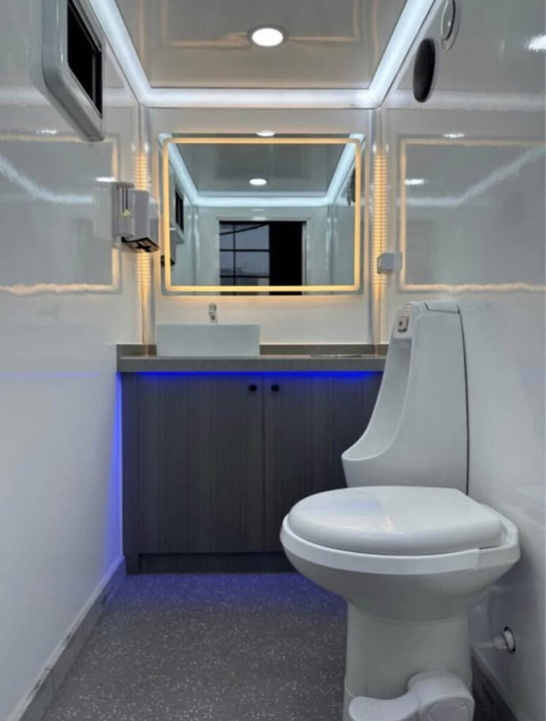 Clean interior of portable toilet rental with sink